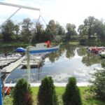 Sailing marina Delfin in Kostrzyn, ships moored to a platform on the water
